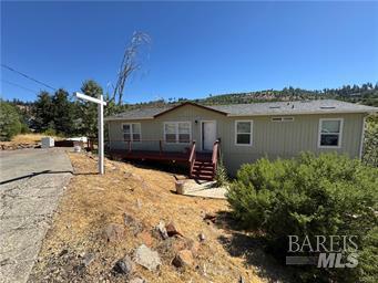 15320 Trinity Road Cobb, CA 95426 - Photo 1 of 11 a view of a house with a yard