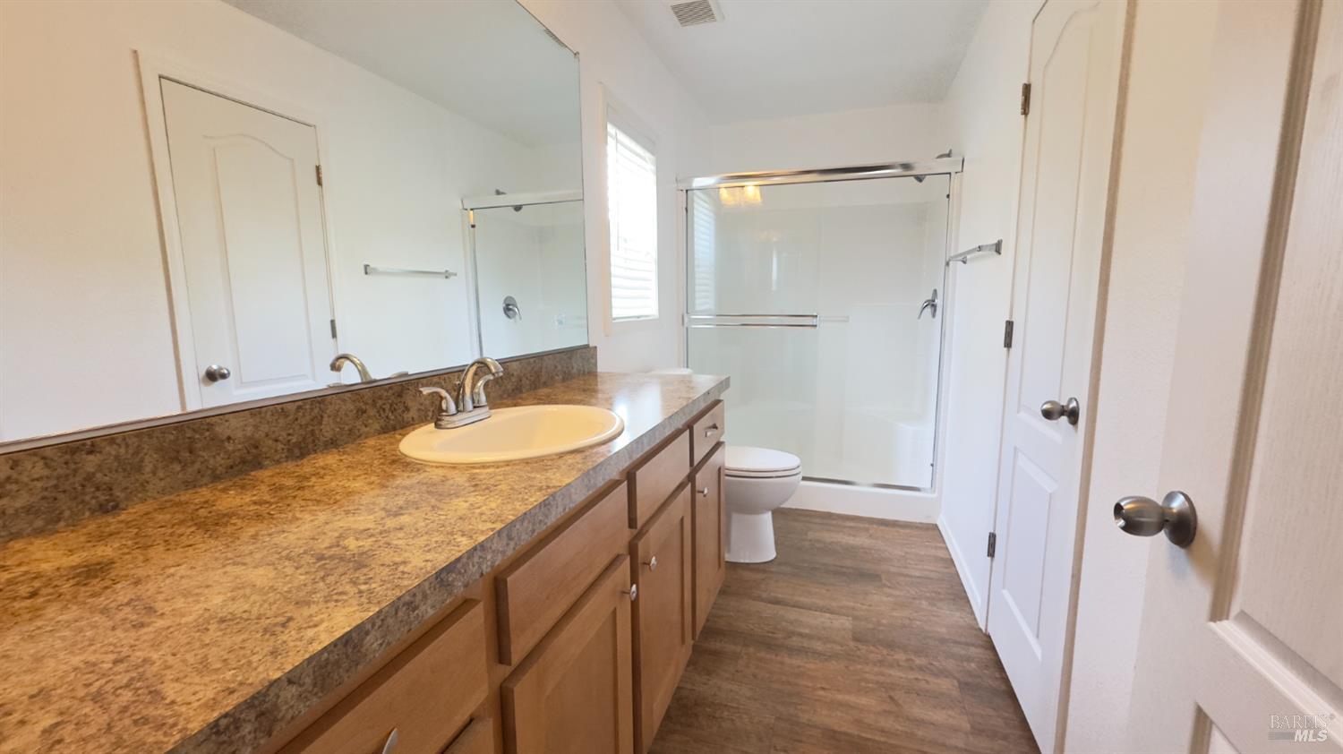 15320 Trinity Road Cobb, CA 95426 - Photo 9 of 11 a bathroom with a granite countertop sink toilet and shower