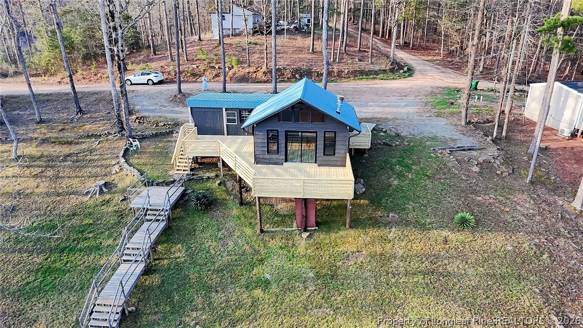 161 White Oak Street Carthage, NC 28327 - Photo 5 of 29 a backyard of a house with table and chairs