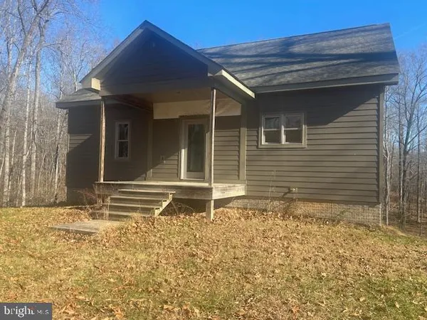 a house with a wooden fence