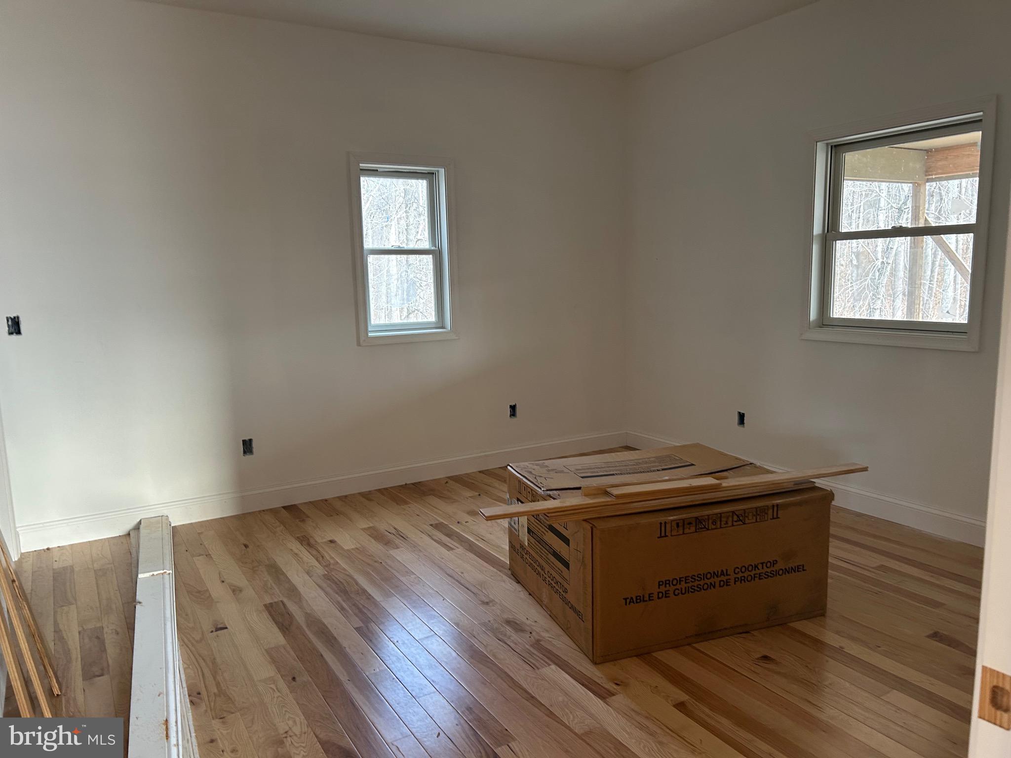 342 South Poes Road Amissville, VA 20106 - Photo 9 of 16 a room with a wooden floor and window