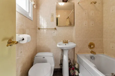 a view of a hallway with wooden floor and a chair