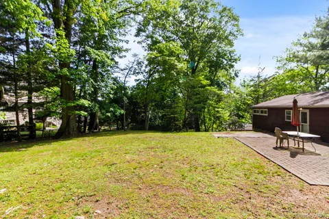 a house view with a sitting space and garden