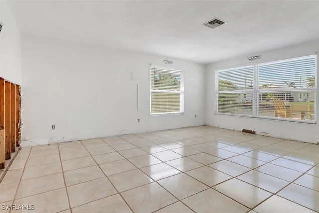 a view of an empty room and window