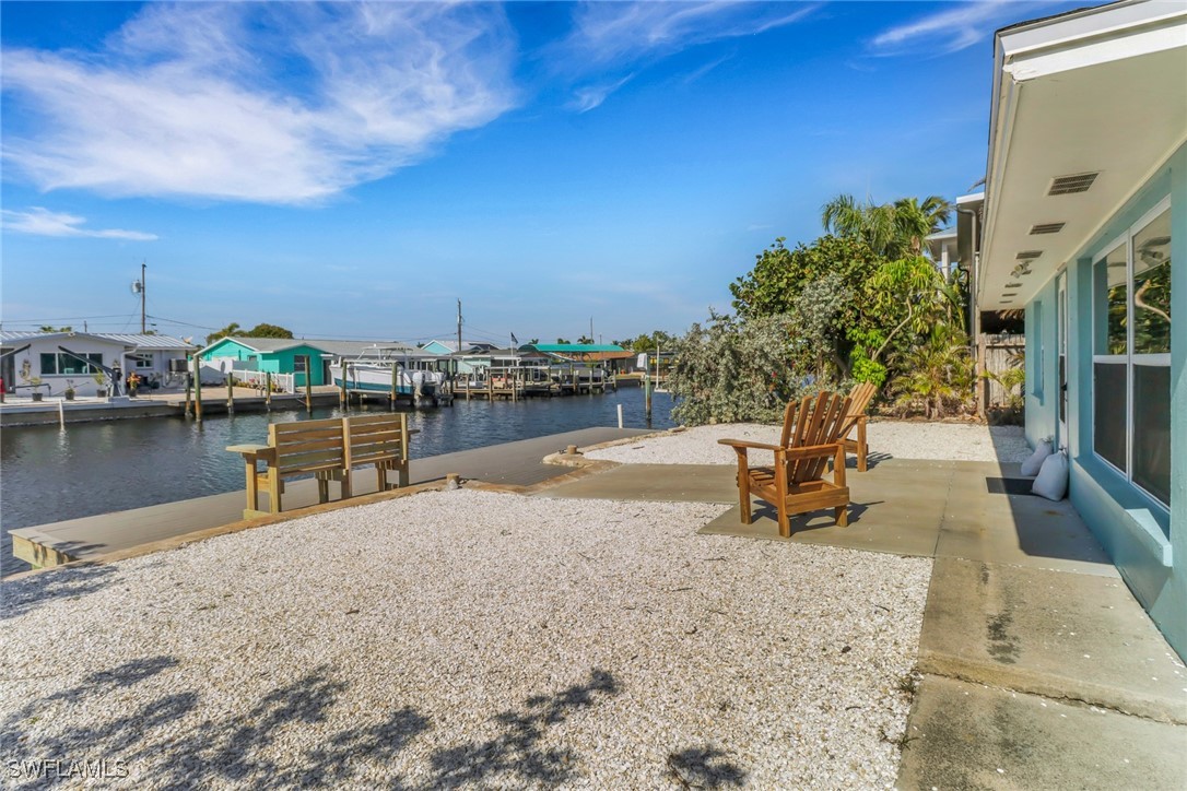 2686 Clyde Street Matlacha, FL 33993 - Photo 3 of 36 a view of a lake with chairs in roof deck