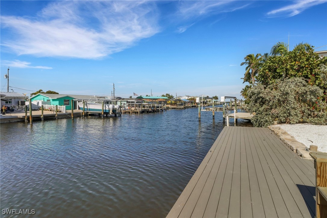2686 Clyde Street Matlacha, FL 33993 - Photo 6 of 36 a view of a lake with boats and trees in the background