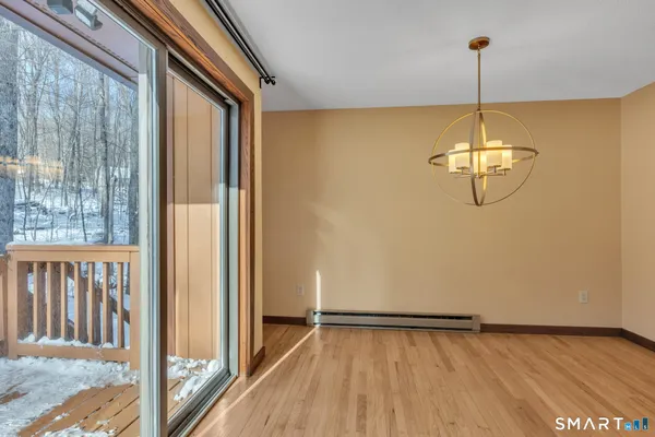 a view of a room with window wooden floor and fence