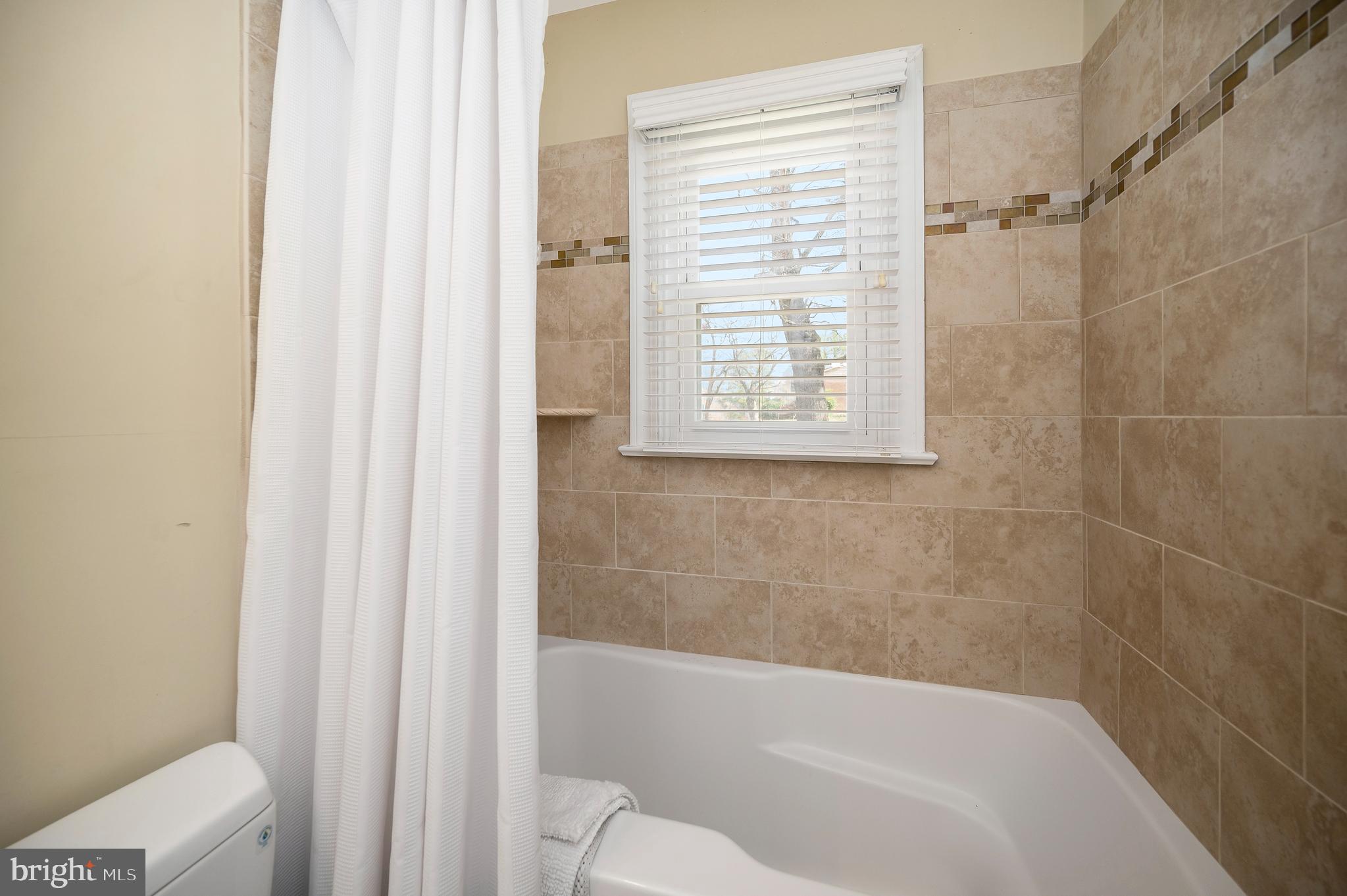 12195 Montford Road Orange, VA 22960 - Photo 19 of 39 Deep tub and tiled shower: Another oasis to enjoy.