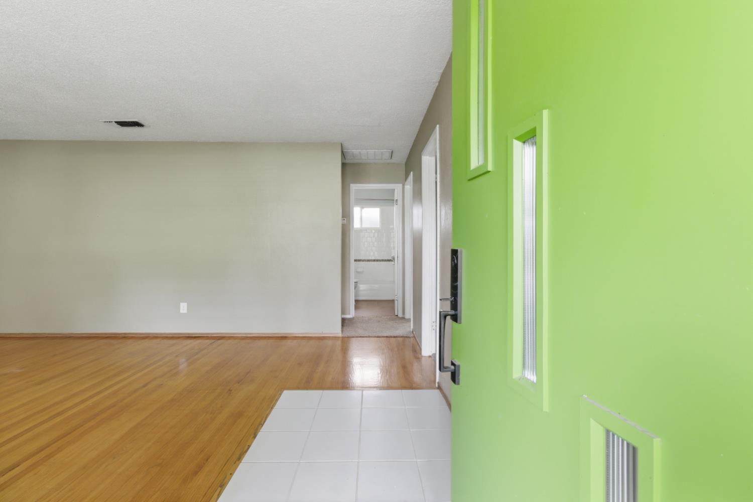 5262 Flagstone Street Carmichael, CA 95608 - Photo 17 of 31 a view of a hallway with wooden floor and a bathroom