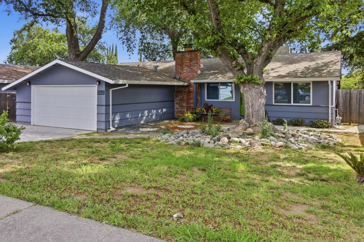 5262 Flagstone Street Carmichael, CA 95608 - Photo 4 of 31 a front view of house with yard and trees