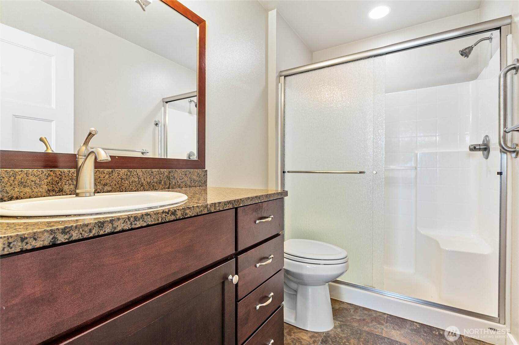 8780 Depot Road, Unit 207 Lynden, WA 98264 - Photo 19 of 37 a bathroom with a granite countertop sink toilet and shower