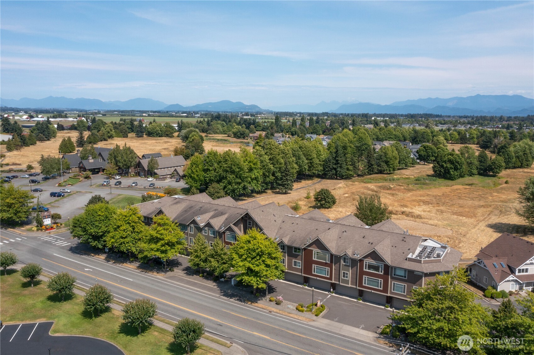 8780 Depot Road, Unit 207 Lynden, WA 98264 - Photo 2 of 37 an aerial view of a house with a lake view
