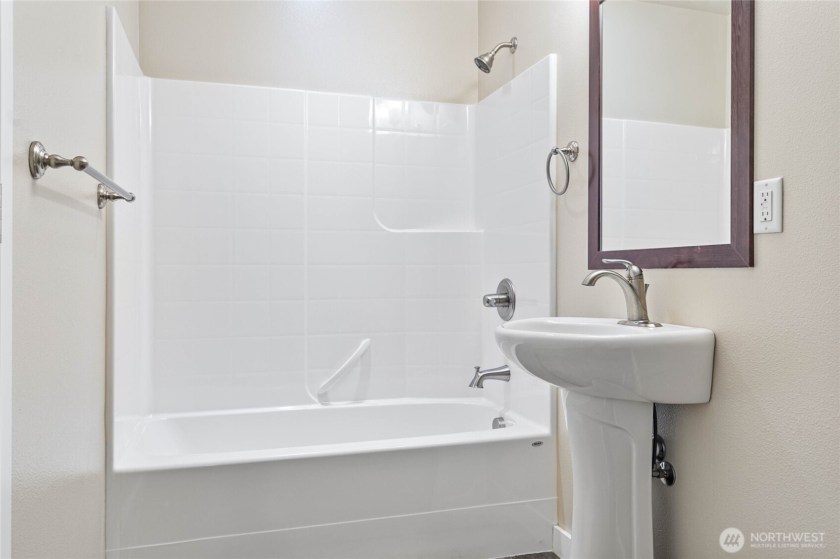 8780 Depot Road, Unit 207 Lynden, WA 98264 - Photo 25 of 37 a bathroom with a sink a shower and a mirror