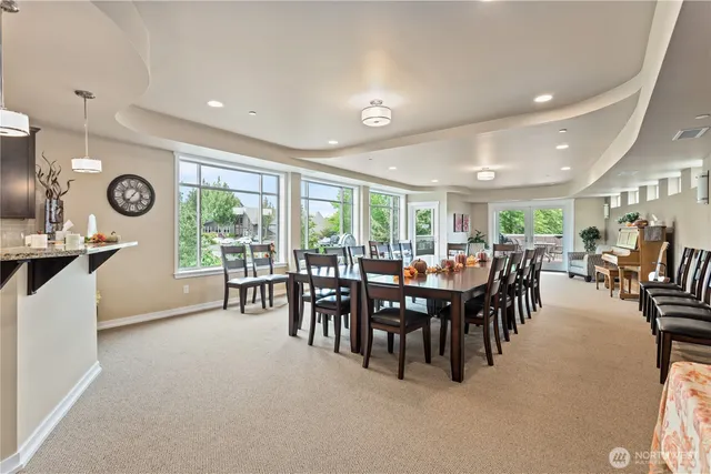 a kitchen with stainless steel appliances granite countertop a sink a stove and a refrigerator