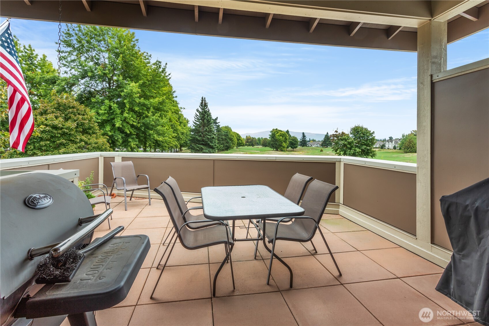 8780 Depot Road, Unit 207 Lynden, WA 98264 - Photo 31 of 37 a view of a chairs and table in the balcony