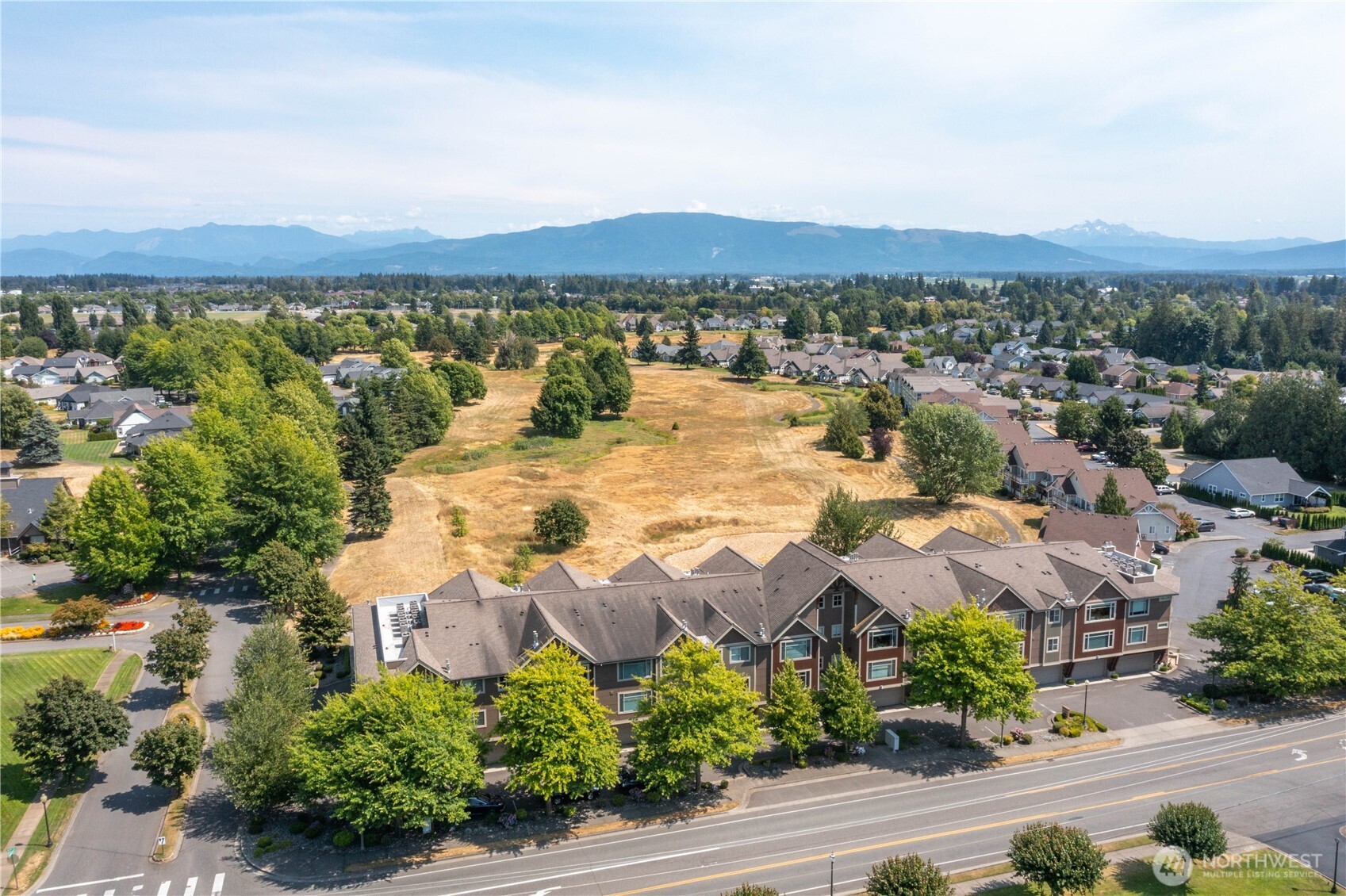 8780 Depot Road, Unit 207 Lynden, WA 98264 - Photo 37 of 37 an aerial view of residential houses with outdoor space and trees