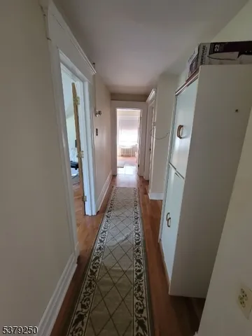 a view of a livingroom from a hallway