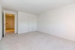a view of an empty room and closet