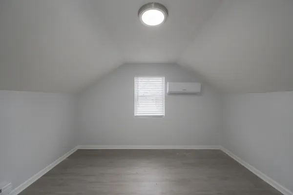 an empty room that has a window