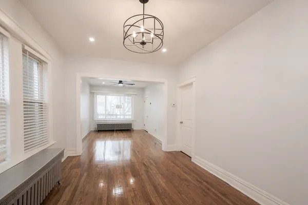 a view of wooden floor and a window
