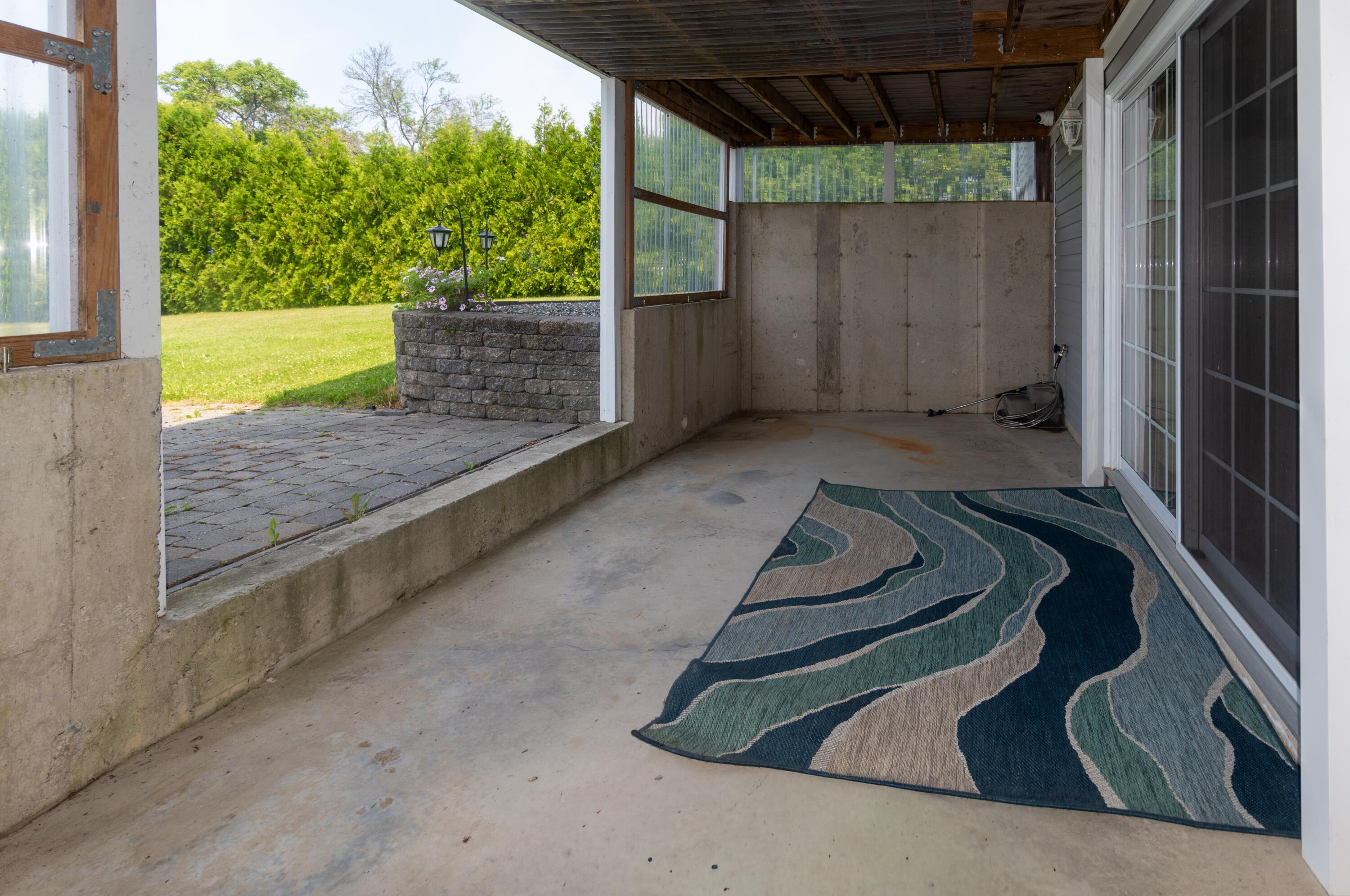 149-161 Lake Shore Road, Unit LOT 202 St. David, ME 04773 - Photo 21 of 62 Lower deck/seating area