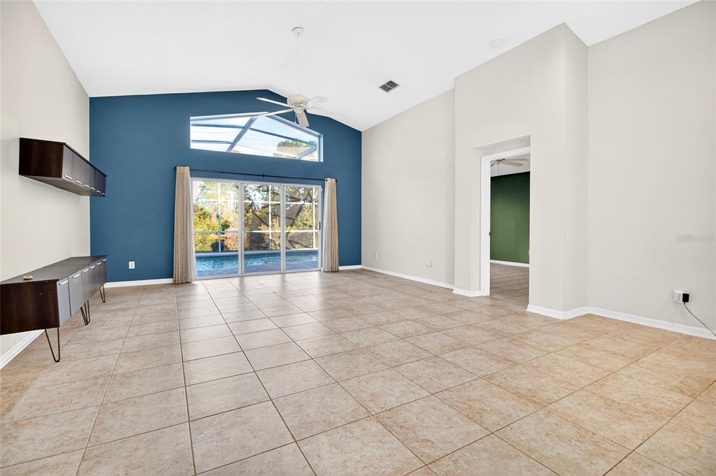 2250 Chase Court Mount Dora, FL 32757 - Photo 14 of 46 a view of an empty room with window and chandelier