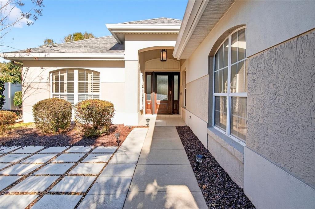 2250 Chase Court Mount Dora, FL 32757 - Photo 40 of 46 a view of a porch with wooden floor and furniture
