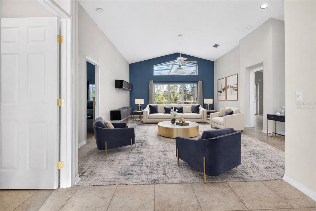 2250 Chase Court Mount Dora, FL 32757 - Photo 5 of 46 a living room with fireplace furniture and a large window