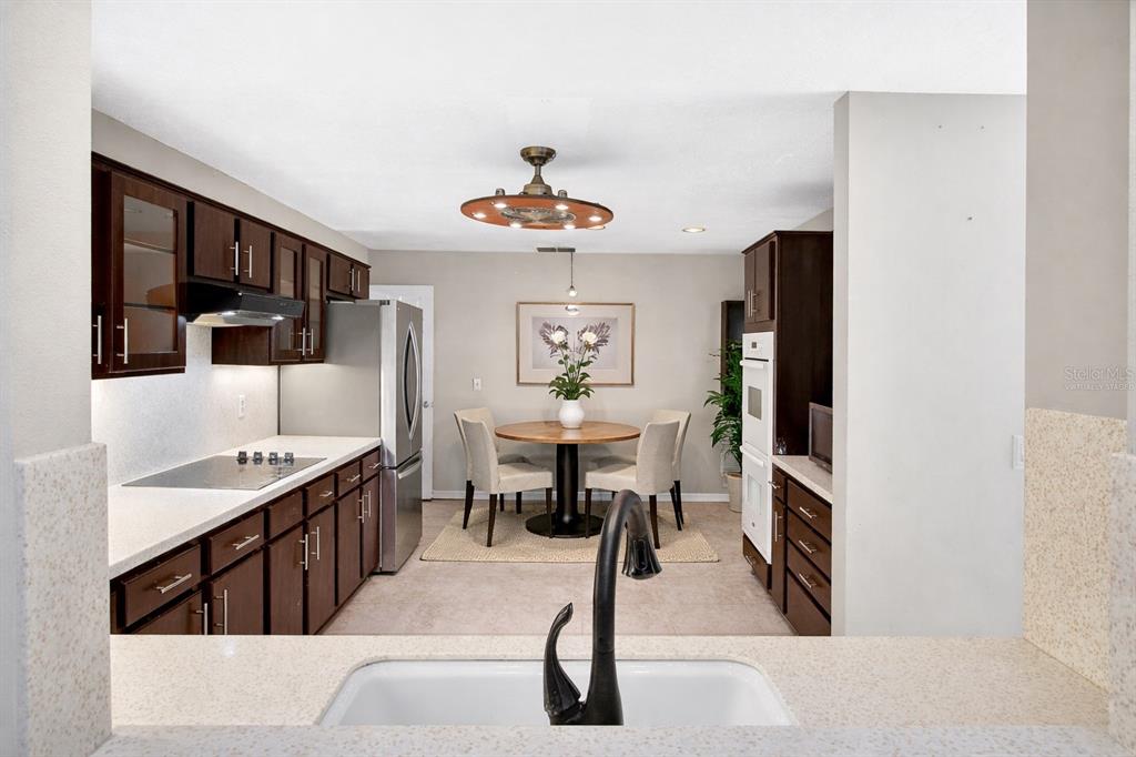 2250 Chase Court Mount Dora, FL 32757 - Photo 10 of 46 a living room with furniture a dining table and chairs