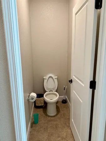 a view of hallway with wooden floor and furniture