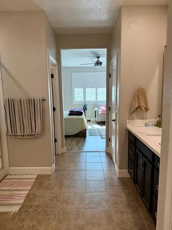 a view of a hallway with a wooden cabinets