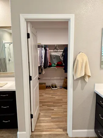 a white toilet sitting next to a bathroom sink