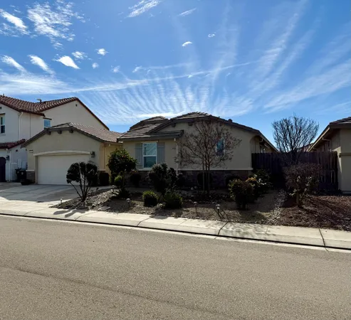a view of a backyard with large trees