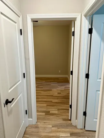 an aerial view of a residential building with an outdoor space and seating