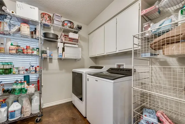 a kitchen with stainless steel appliances granite countertop a stove and a cabinets