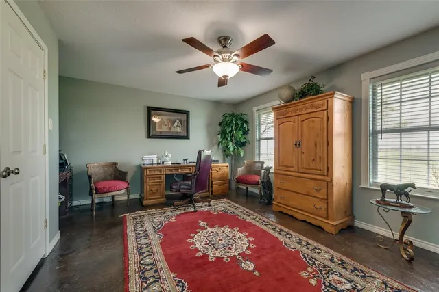 a living room with furniture and a rug
