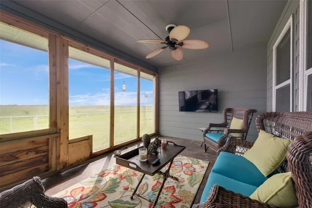 a view of a livingroom with furniture and a flat screen tv