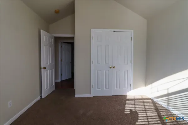 a view of a hallway with closet