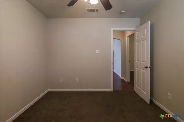 an empty room with a bathroom