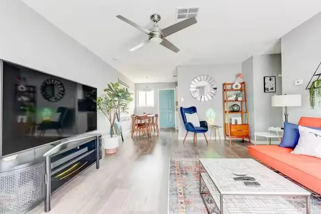 a living room with furniture and a flat screen tv