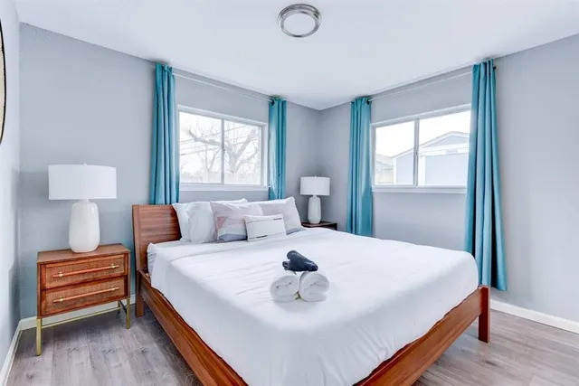 a bedroom with a bed and a window