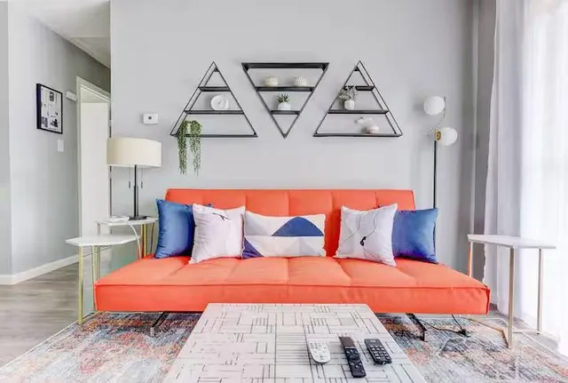 a bedroom with a bed and a night stand