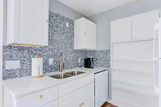 a kitchen with a stove and a microwave