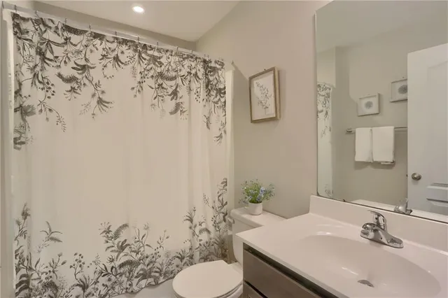 a bathroom with a sink and toilet