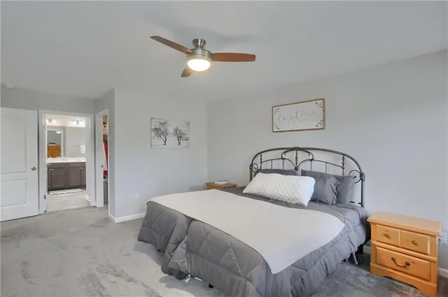 a bathroom with double sink and a mirror