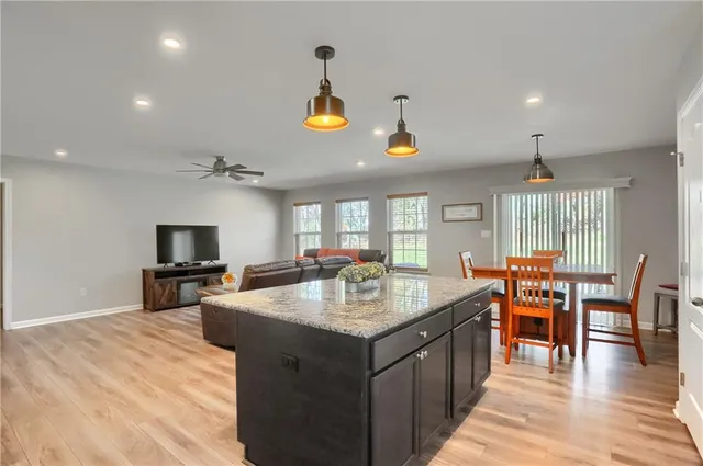 a kitchen with a sink and stainless steel appliances