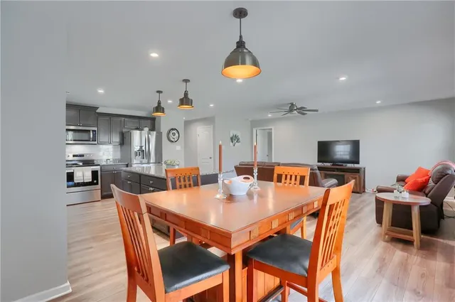 a view of a dining room with furniture window and wooden floor