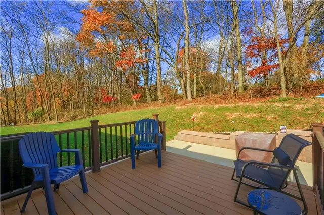 a balcony with furniture and wooden floor