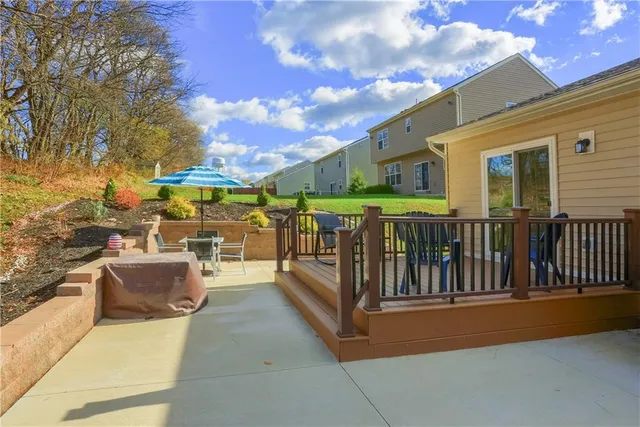 a view of a chairs and table under an umbrella
