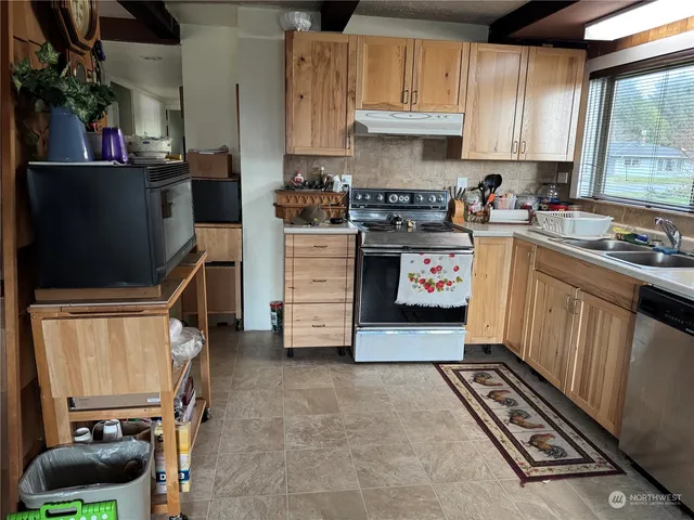 a view of a hallway with stairs